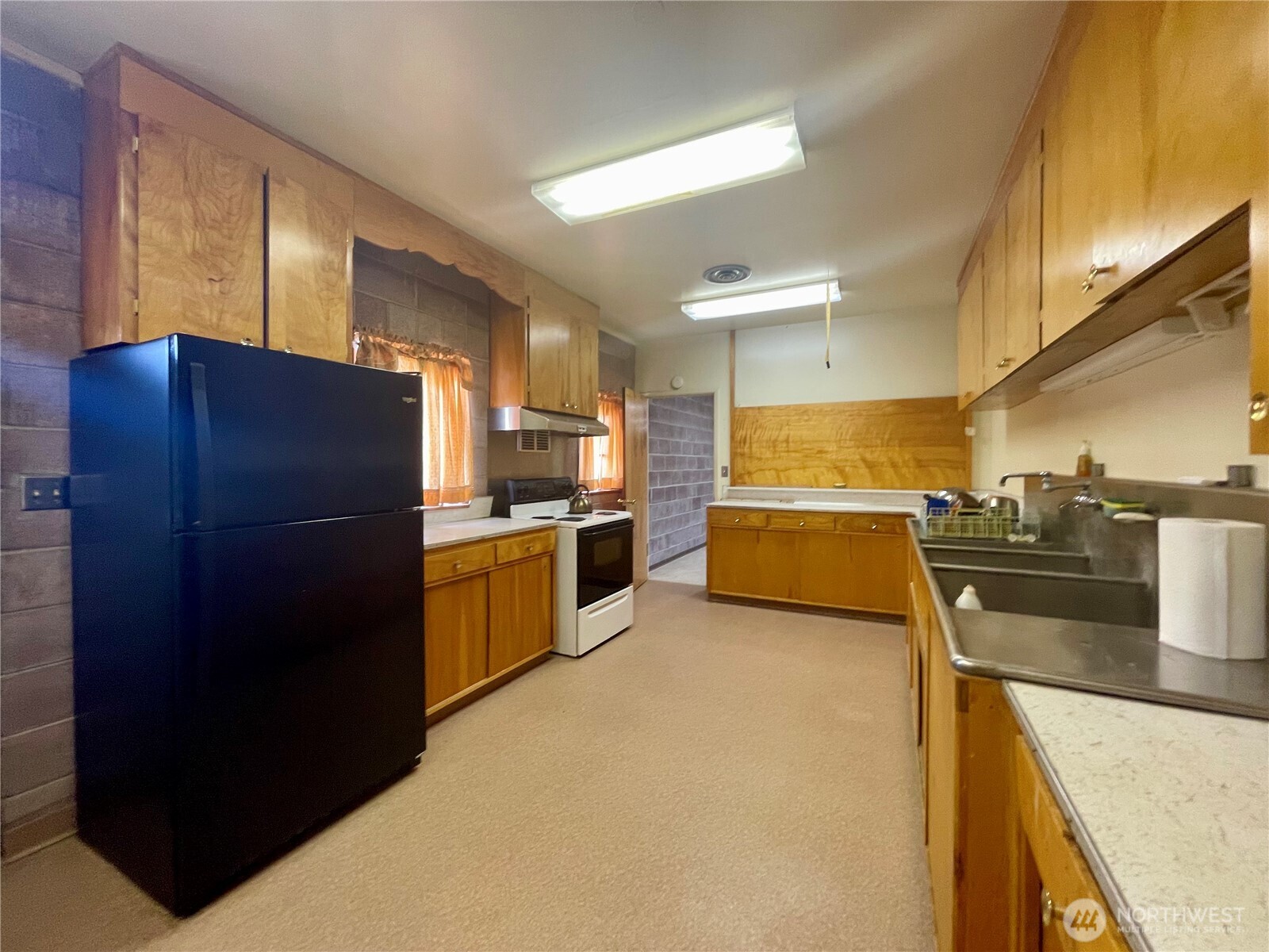 138 Range Street Hartline, WA 99135 - Photo 23 of 34 a kitchen with a refrigerator and a sink