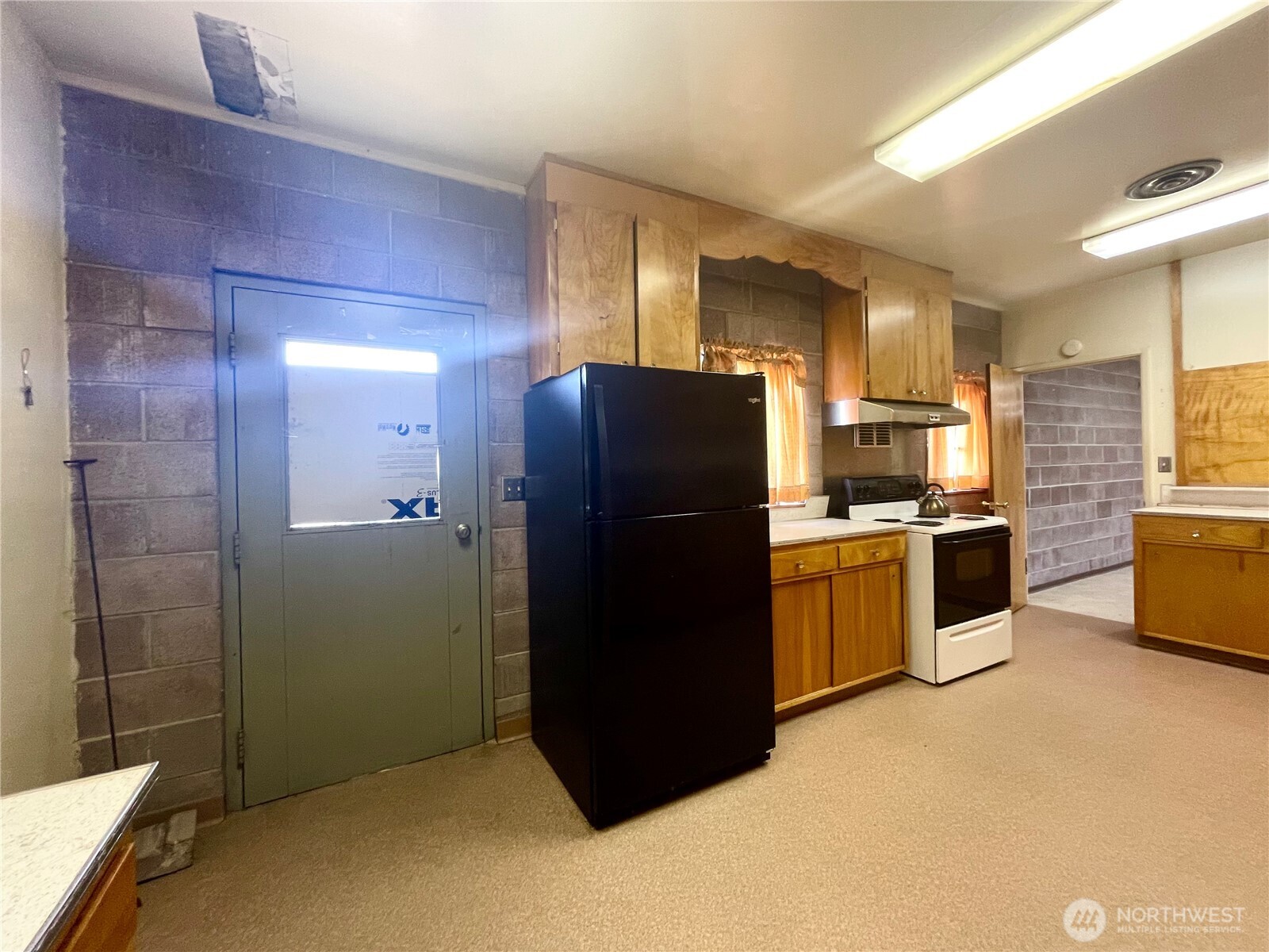 138 Range Street Hartline, WA 99135 - Photo 26 of 34 a kitchen with a refrigerator and a sink