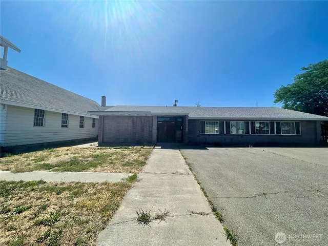 a view of a livingroom with furniture and an empty room