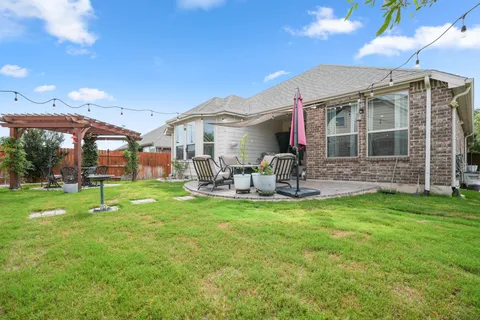 a view of a house with a yard porch and sitting area