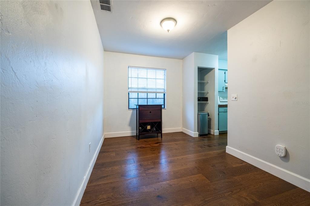2116 Southwest 73rd Street Gainesville, FL 32607 - Photo 11 of 35 wooden floor in an empty room with a window