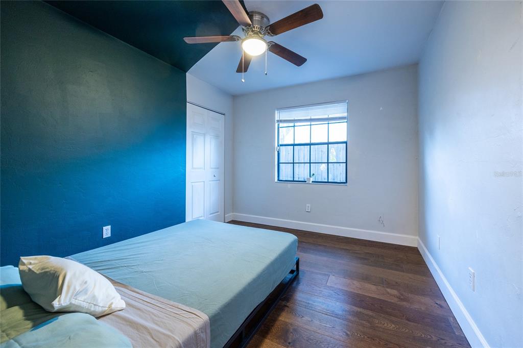 2116 Southwest 73rd Street Gainesville, FL 32607 - Photo 17 of 35 a bedroom with a bed and a window