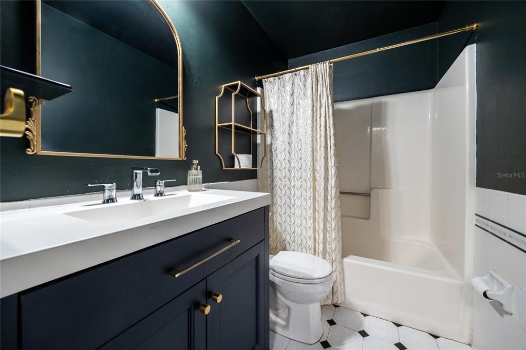 2116 Southwest 73rd Street Gainesville, FL 32607 - Photo 28 of 35 a bathroom with a sink a toilet and shower