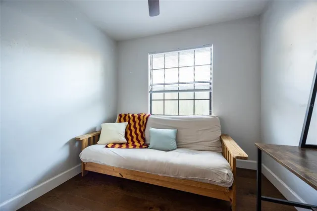 a bedroom with a bed and window