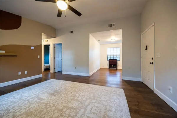 a view of a livingroom with wooden floor