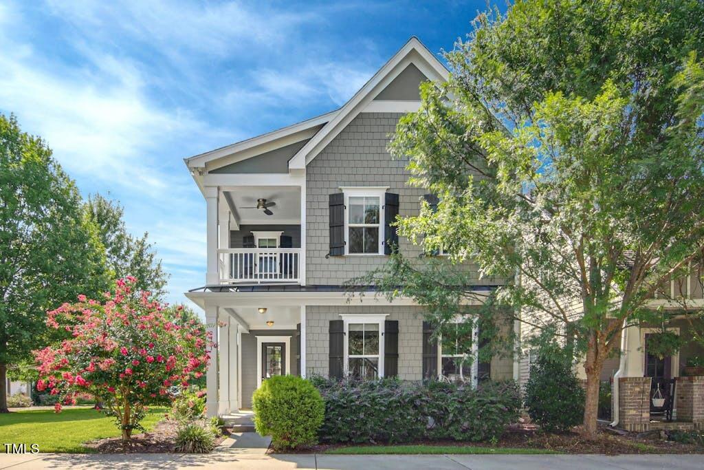 2471 Briar Chapel Parkway Chapel Hill, NC 27516 - Photo 1 of 48 a front view of a house with a garden
