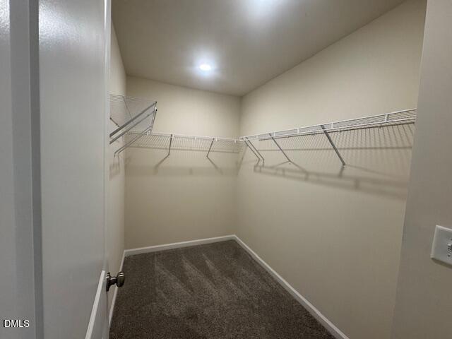 448 Glen Clova Drive Raleigh, NC 27603 - Photo 12 of 23 a view of a room with racks on the wall