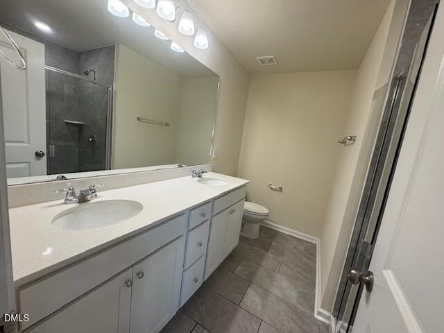 448 Glen Clova Drive Raleigh, NC 27603 - Photo 13 of 23 a bathroom with a double vanity sink and a mirror