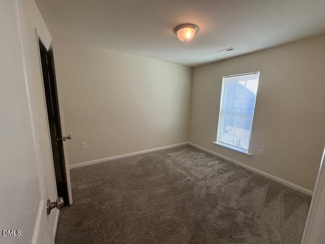 448 Glen Clova Drive Raleigh, NC 27603 - Photo 16 of 23 an empty room with windows