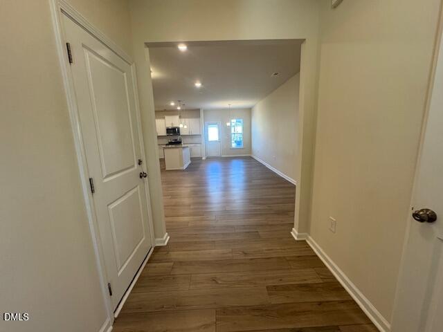 448 Glen Clova Drive Raleigh, NC 27603 - Photo 3 of 23 a view of a hallway view with wooden floor