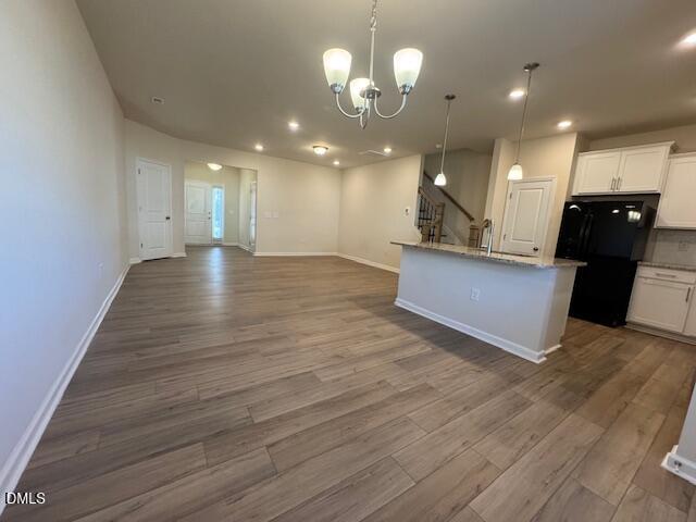 448 Glen Clova Drive Raleigh, NC 27603 - Photo 5 of 23 a view of a kitchen with a sink and a fireplace