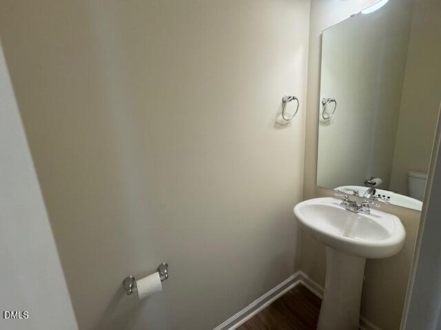 448 Glen Clova Drive Raleigh, NC 27603 - Photo 8 of 23 a bathroom with a sink and mirror