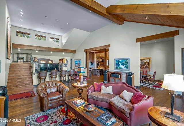 a living room with furniture and a floor to ceiling window