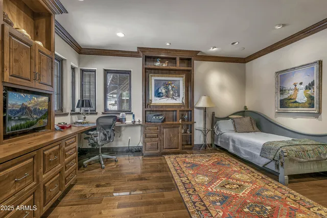 a bed room with a bed and a chair