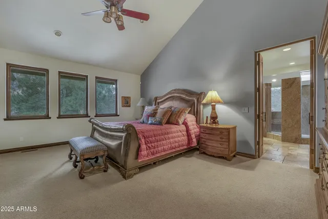 a bathroom with a tub a sink and glass door