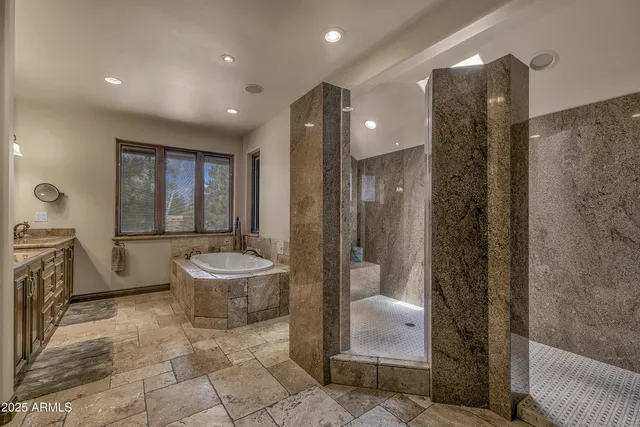 a bedroom with bed and glass door