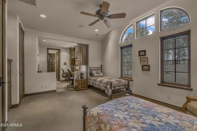 a bathroom with a granite countertop sink mirror and a bathtub