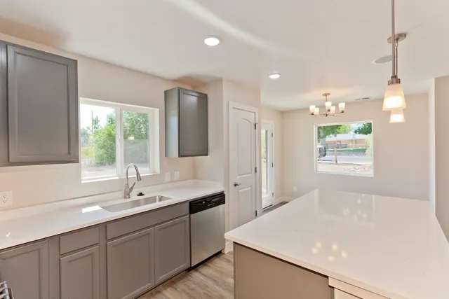 a bathroom with a sink and a window
