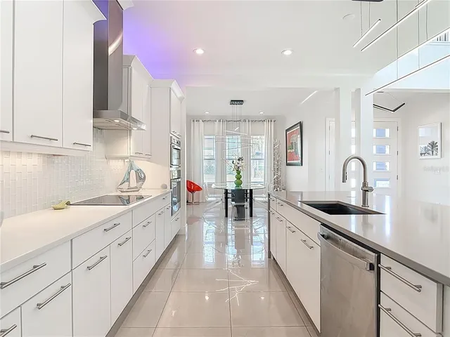 a kitchen with sink and cabinets