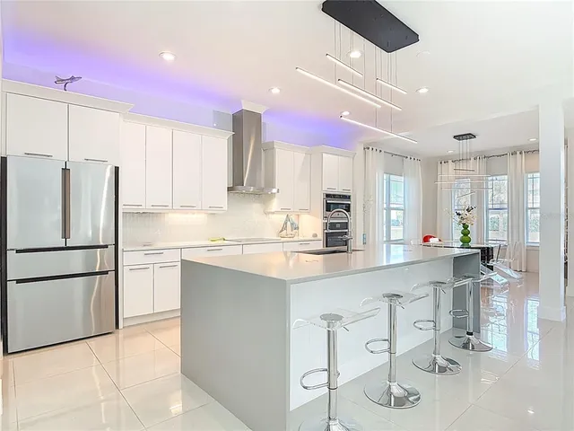 a kitchen with a sink cabinets and window