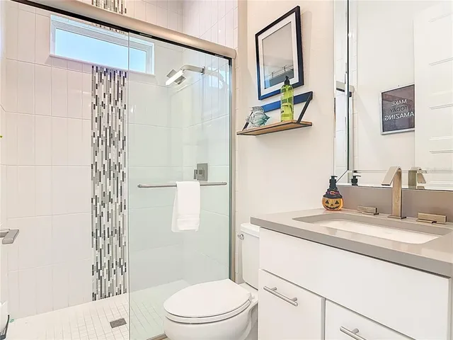 a bedroom with a bed and a table