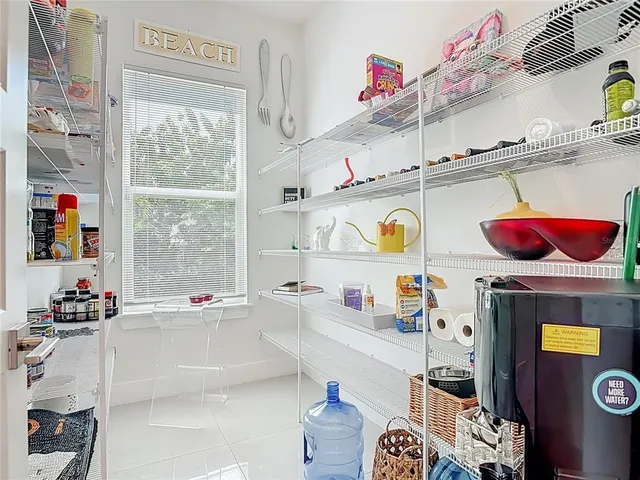 a view of an outdoor dining space with a table and chairs