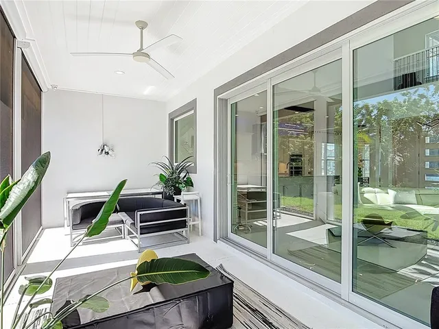 a view of swimming pool with a garden and plants