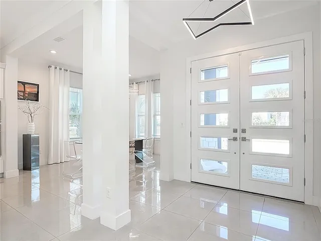 a view of an empty room with glass door