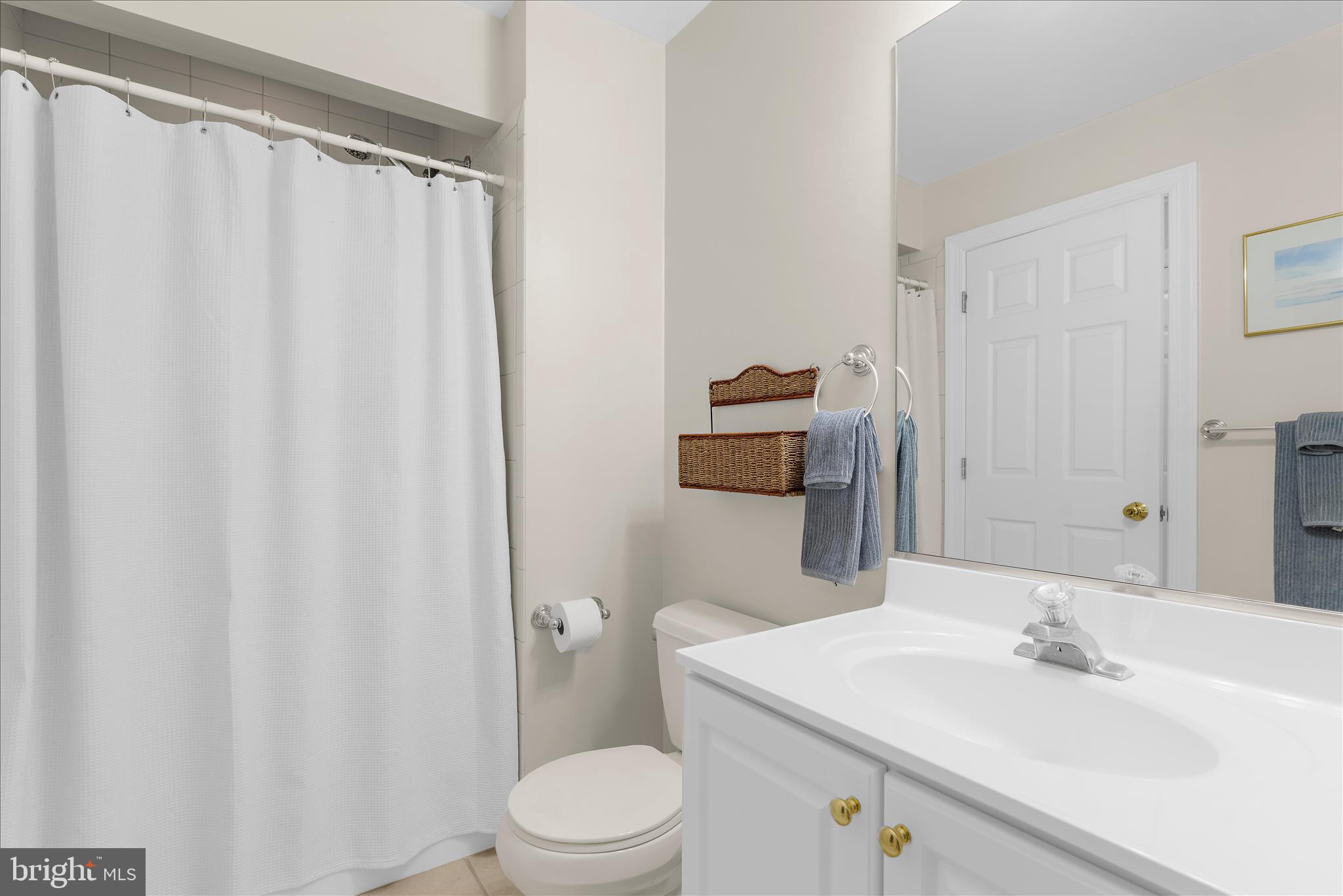 1848 Cherry Road Annapolis, MD 21409 - Photo 15 of 57 a bathroom with a sink a toilet and shower curtain