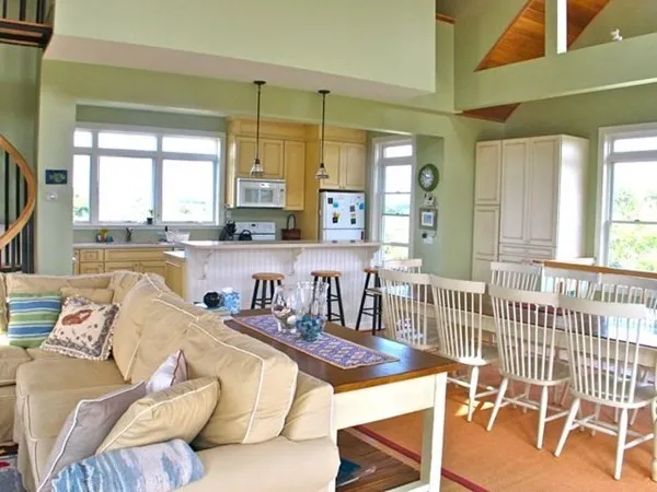 a living room with furniture and a table