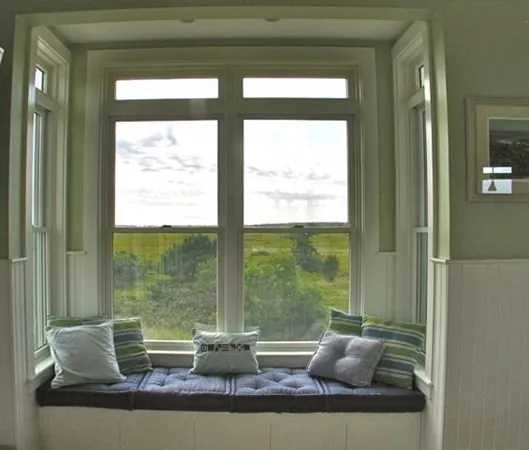 a view of lot of living room with furniture and window