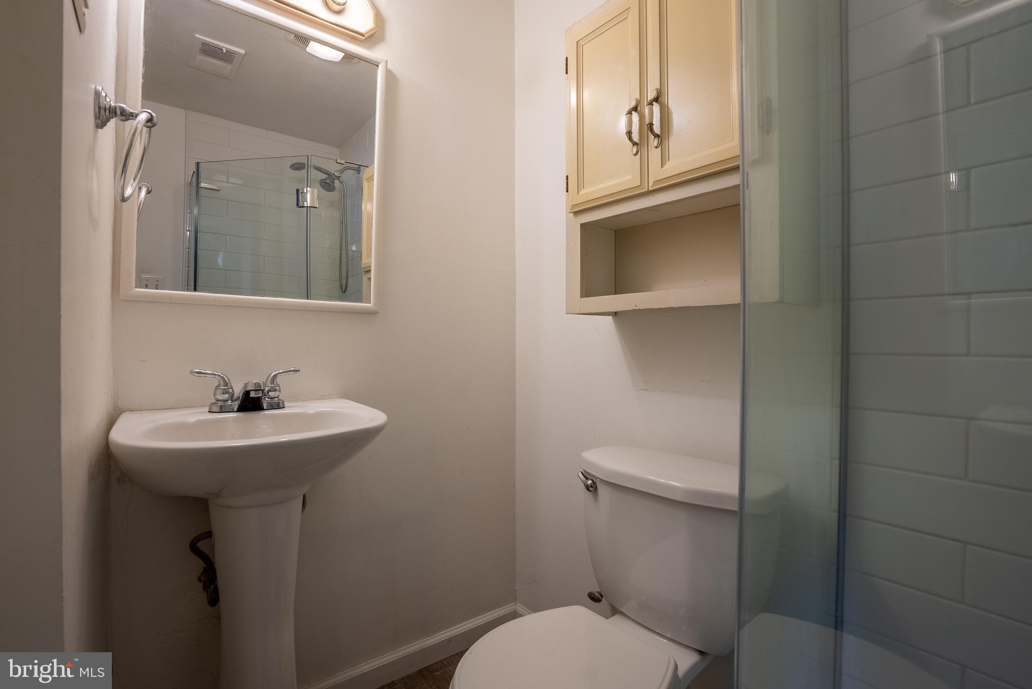 2275 Dairy Farm Road Gambrills, MD 21054 - Photo 36 of 57 a bathroom with a sink a toilet and mirror