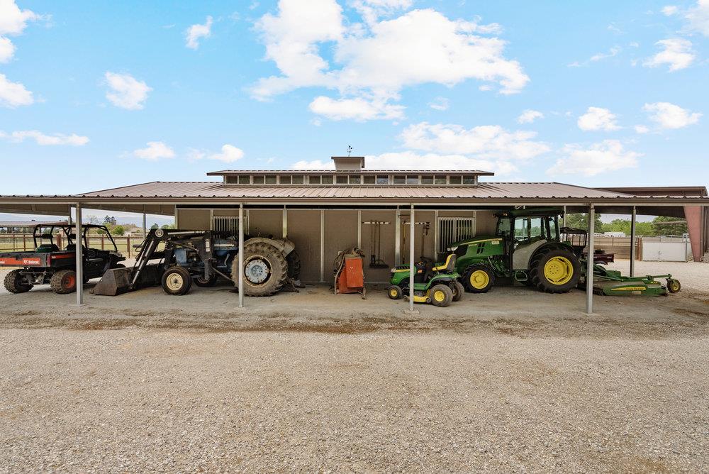 804 Comstock Road Hollister, CA 95023 - Photo 14 of 47 a view of a bike garage with a bike and car