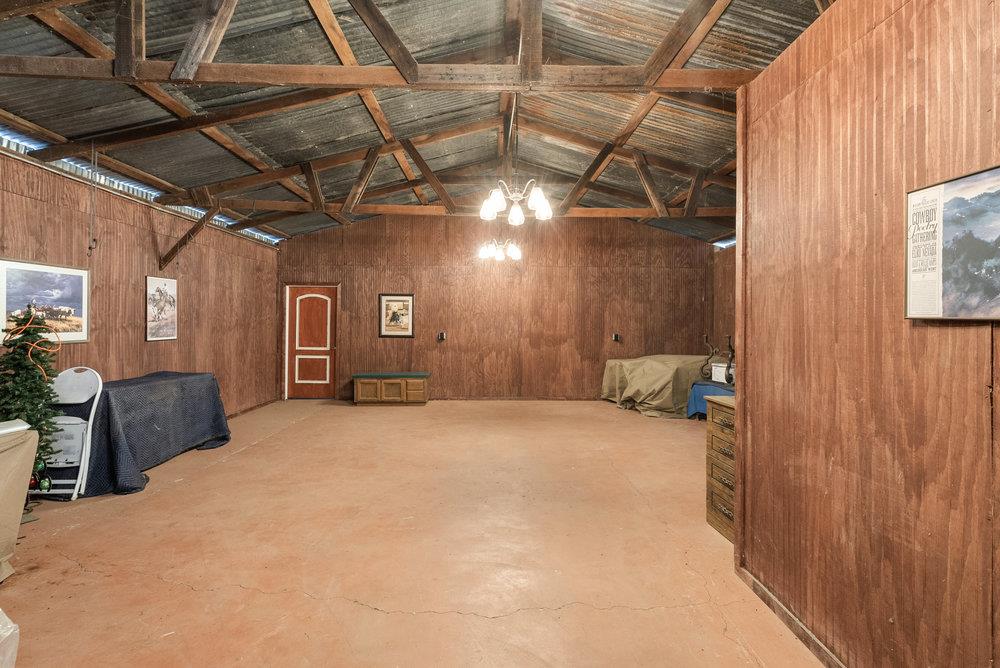 804 Comstock Road Hollister, CA 95023 - Photo 20 of 47 a spacious bedroom with a bed and a chandelier