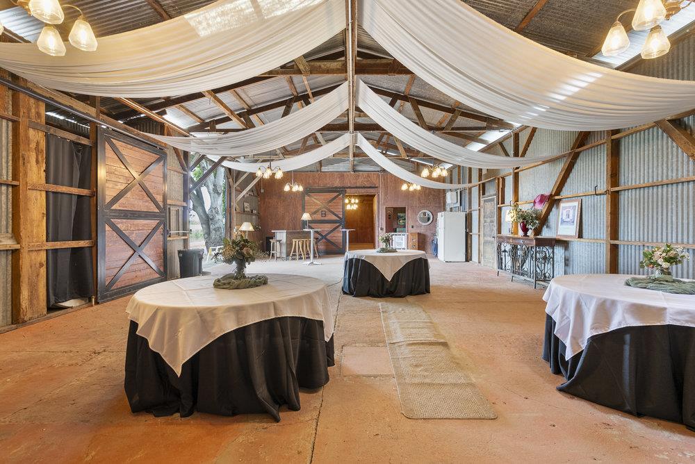 804 Comstock Road Hollister, CA 95023 - Photo 22 of 47 a view of a patio with table and chairs with wooden floor