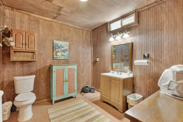 an empty room with large windows