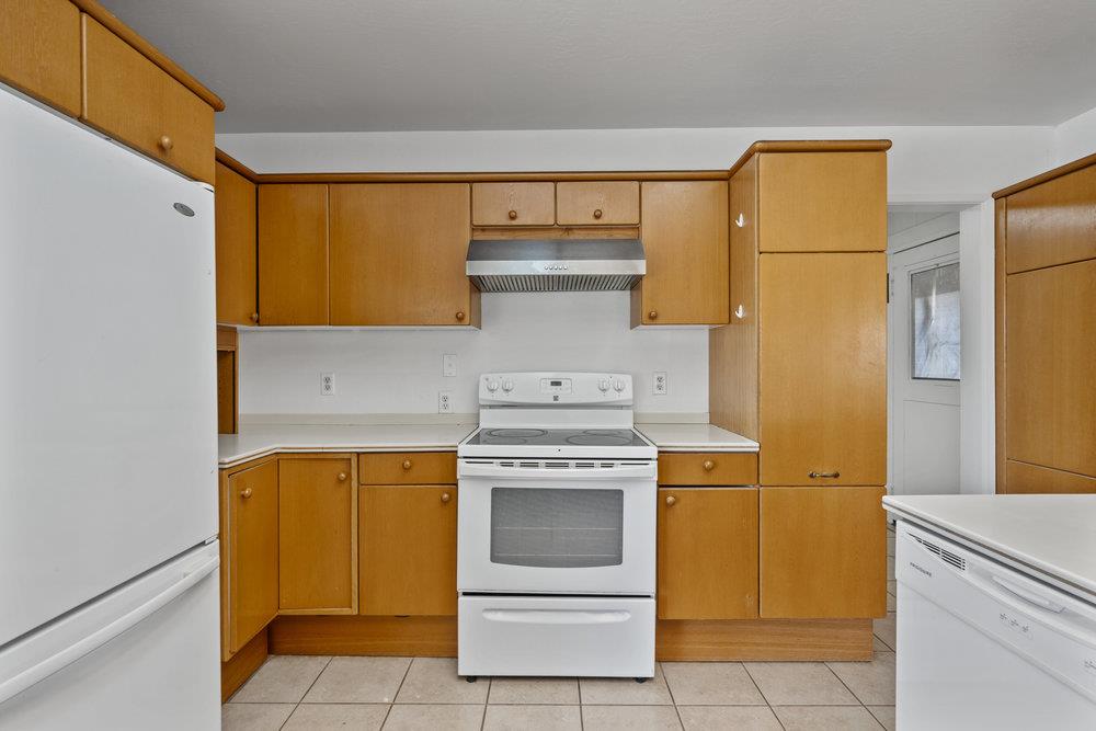 804 Comstock Road Hollister, CA 95023 - Photo 30 of 47 a kitchen with a stove and a refrigerator