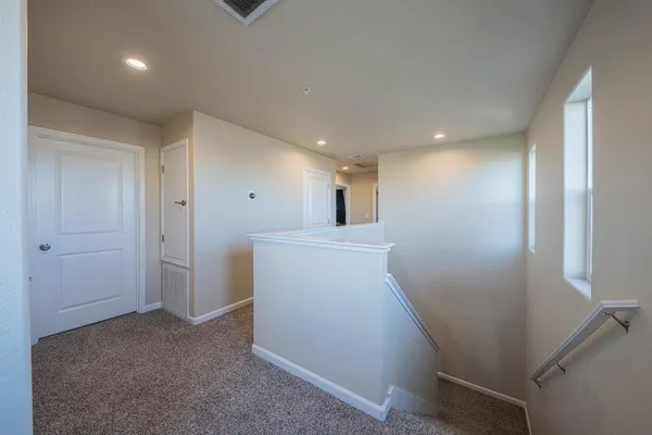 a view of a hallway with workspace