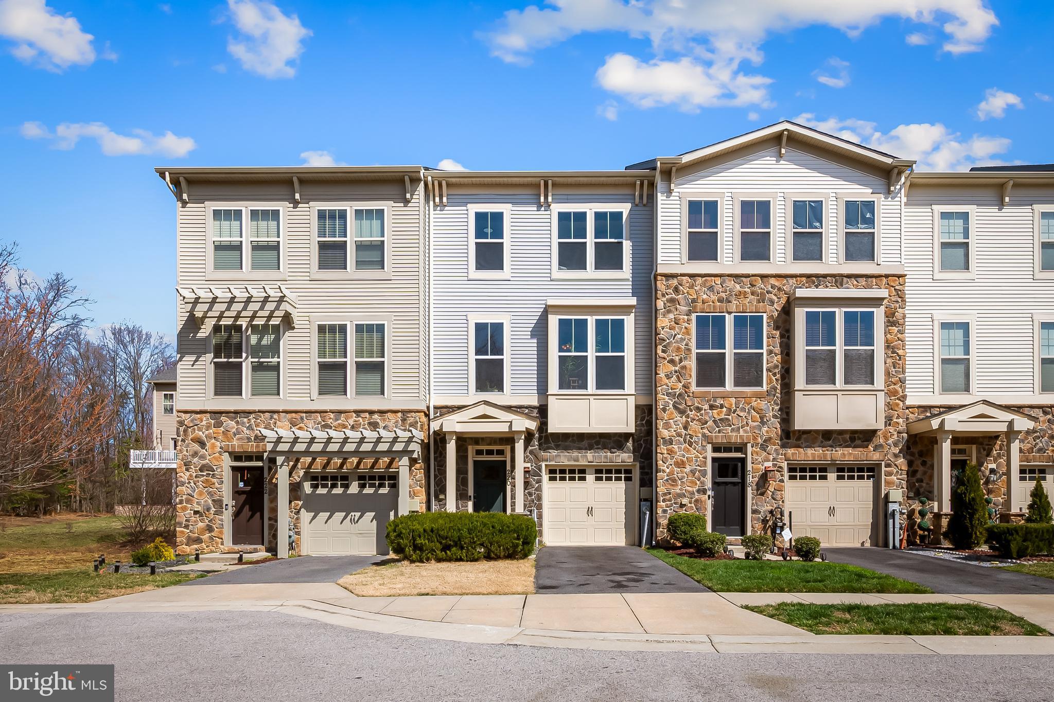 220 Tanner Lane Glen Burnie, MD 21060 - Photo 1 of 48 a front view of a building with a garden and plants