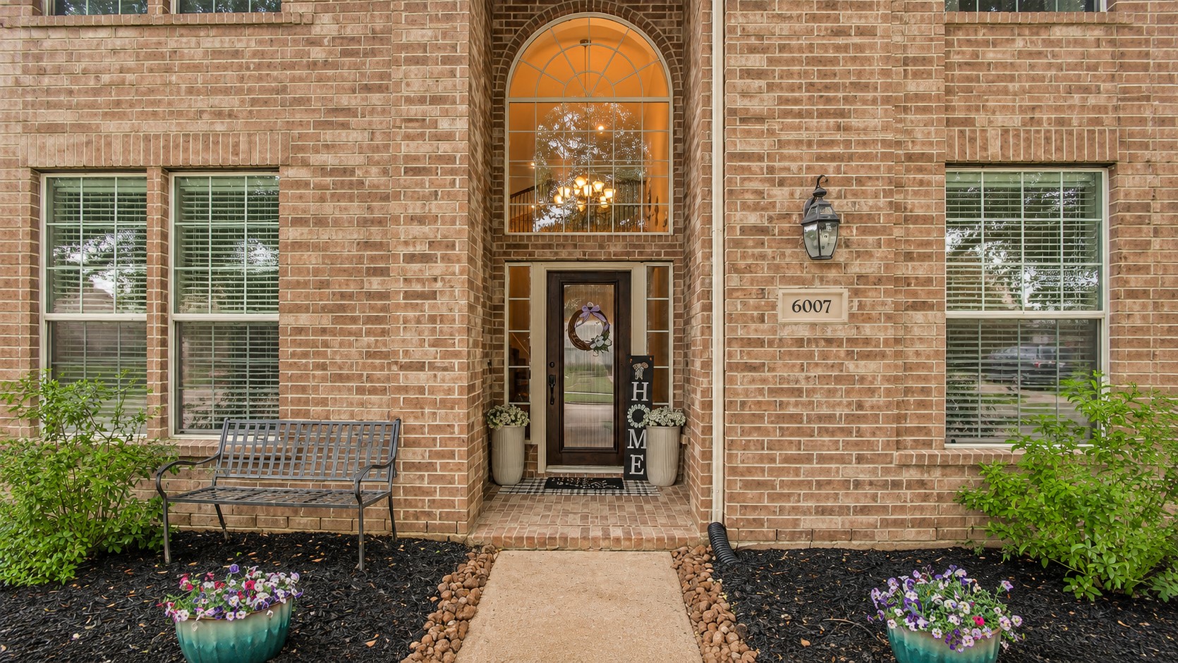 6007 Valhalla Drive Spring, TX 77379 - Photo 2 of 37 A dramatic two-story entry showcases elegant architectural details and sets the tone for the home's refined interior.