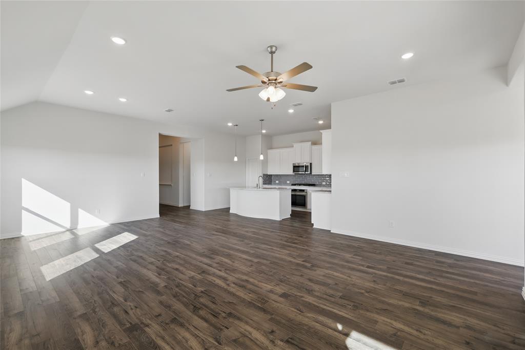 2529 Rivers W Road Anna, TX 75409 - Photo 10 of 22 Unfurnished living room with a ceiling fan, recessed lighting, and dark wood-type flooring