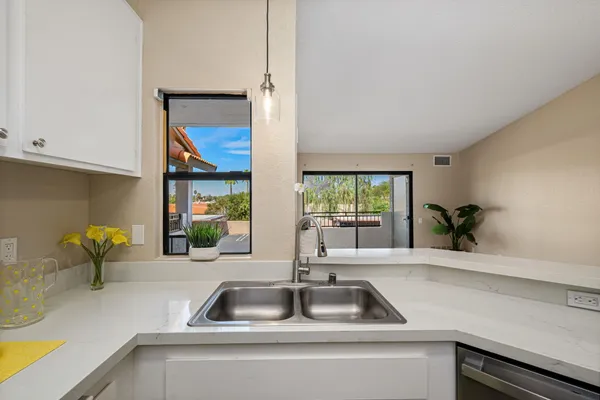 a kitchen with a sink and a window