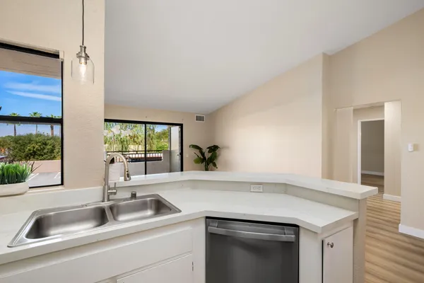 a kitchen with a sink and a window
