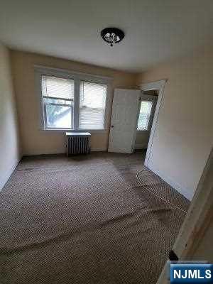 24 Washington Place, Unit 2 Teaneck, NJ 07666 - Photo 12 of 12 an empty room with windows