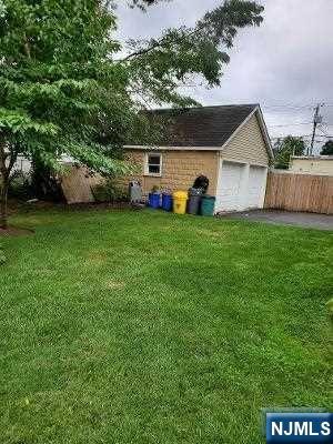 24 Washington Place, Unit 2 Teaneck, NJ 07666 - Photo 2 of 12 a house view with a garden space