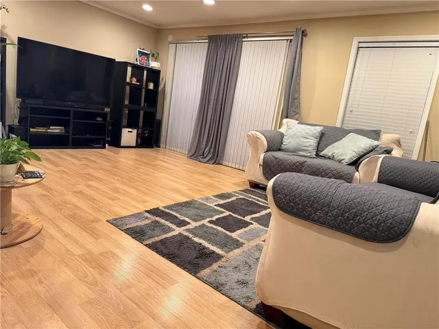 a living room with a couch and a flat screen tv