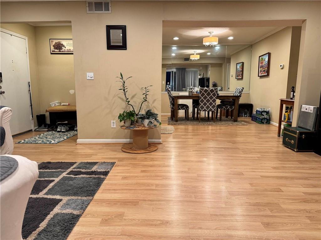 6851 Roswell Road, Unit O24 Sandy Springs, GA 30328 - Photo 4 of 10 a lobby with furniture and a potted plant