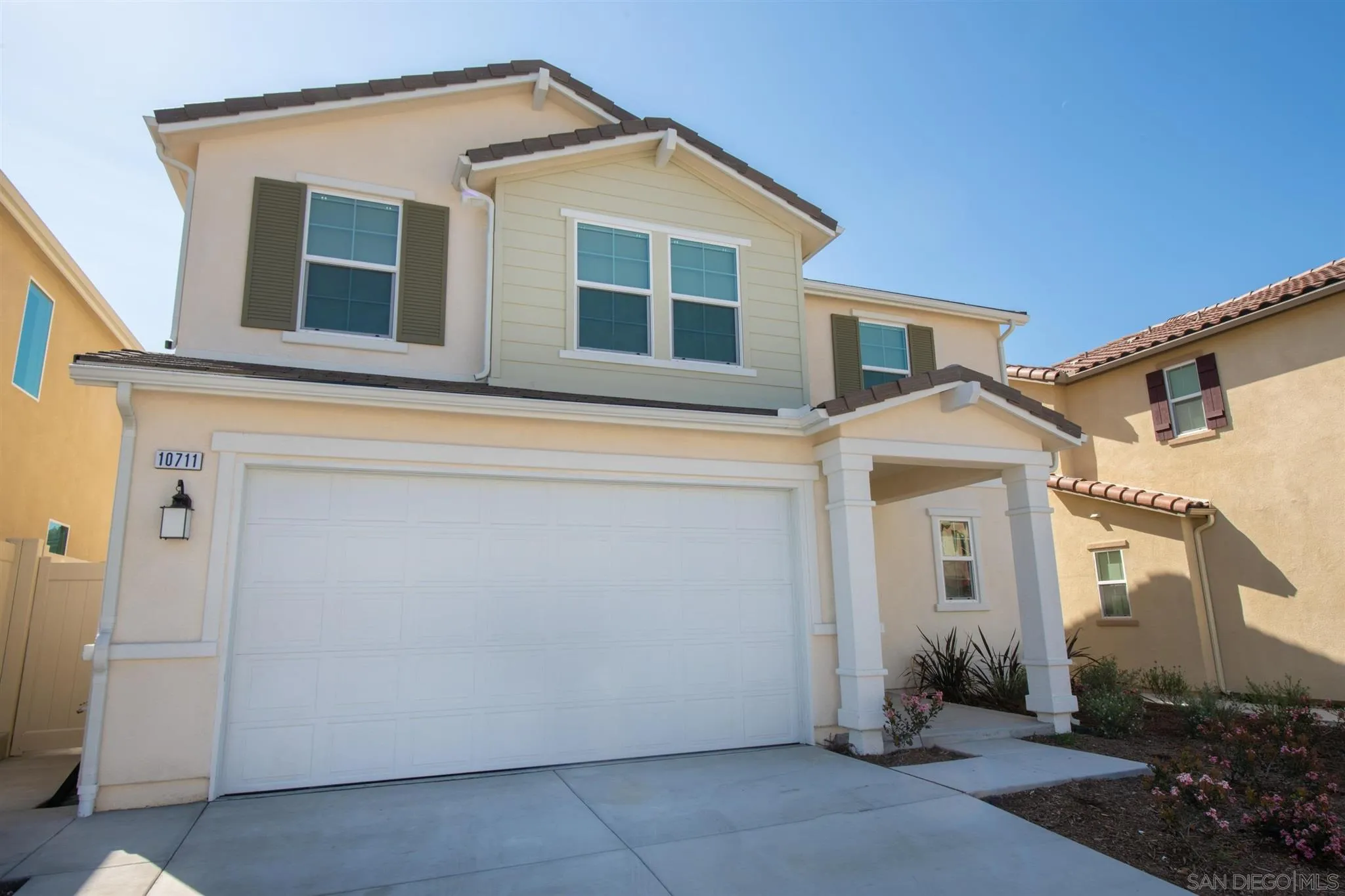 10711 Porter Terrace Spring Valley, CA 91978 - Photo 1 of 17 a front view of a house with a garage