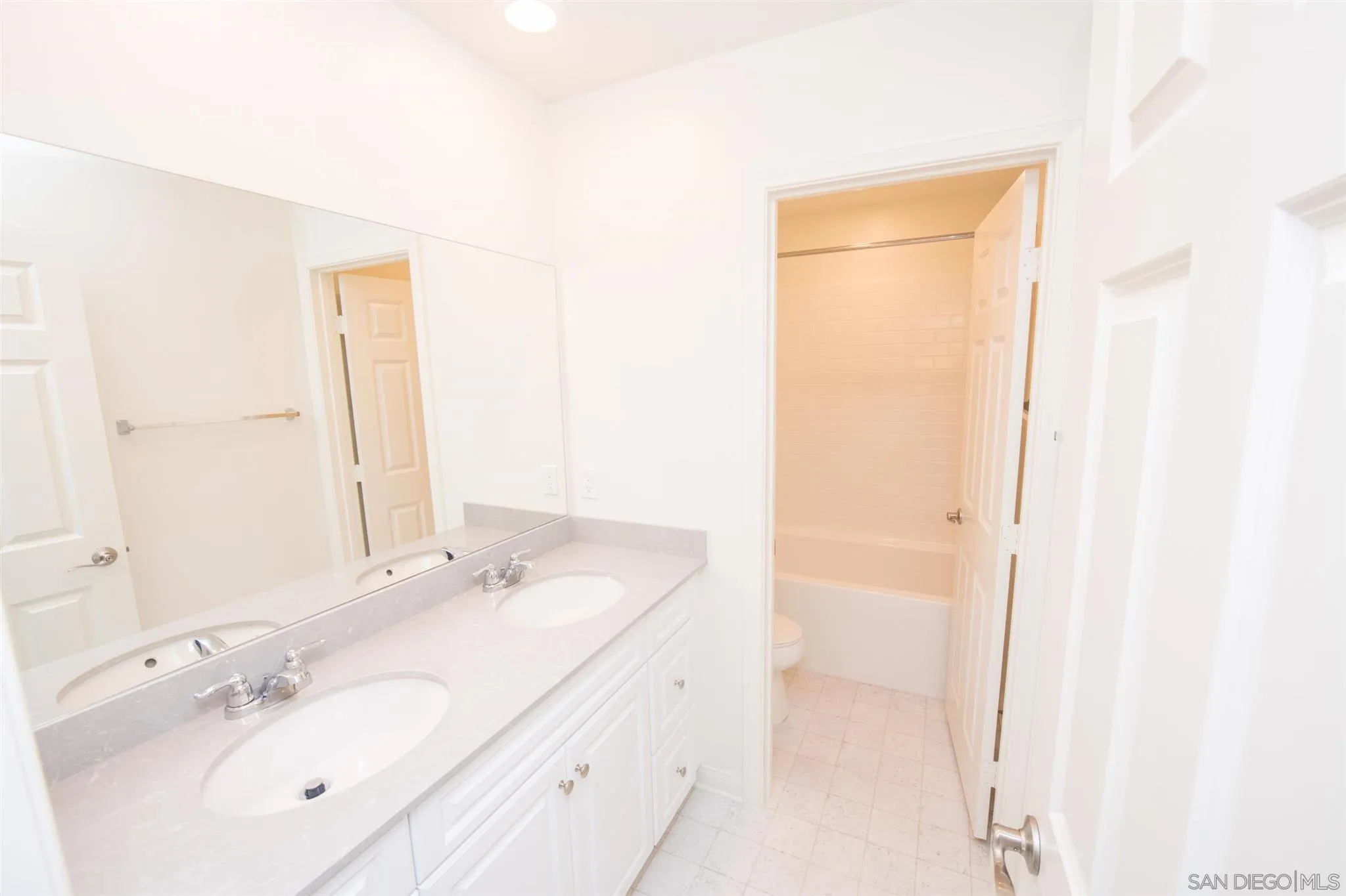 10711 Porter Terrace Spring Valley, CA 91978 - Photo 14 of 17 a bathroom with a sink a mirror and a shower