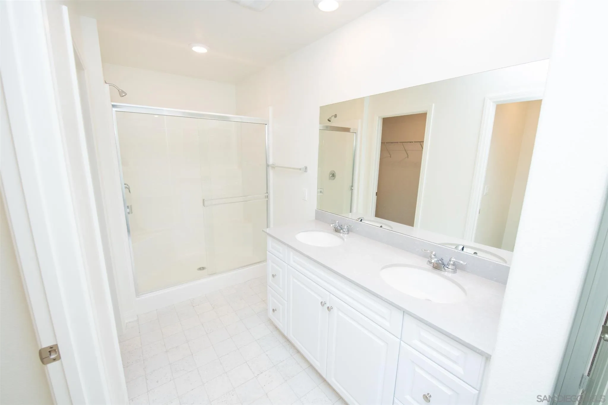 10711 Porter Terrace Spring Valley, CA 91978 - Photo 15 of 17 a bathroom with a double vanity sink and a mirror
